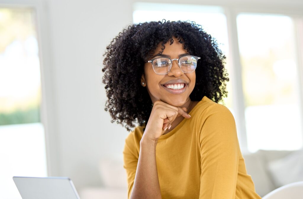 Person smiling and wearing glasses.